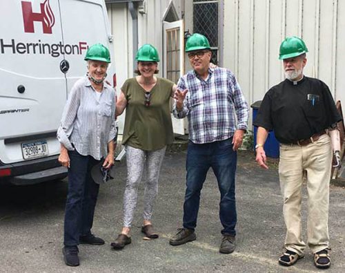 Left to right: Lucy Eldridge, Marjorie Hoog, Dale Peterson, 
and Rev. John Thompson meet at St. John’s to watch Herrington Fuels install new energy-saving propane-fired boiler heating systems in the basements of the Church and Burke Hall in the Rectory.